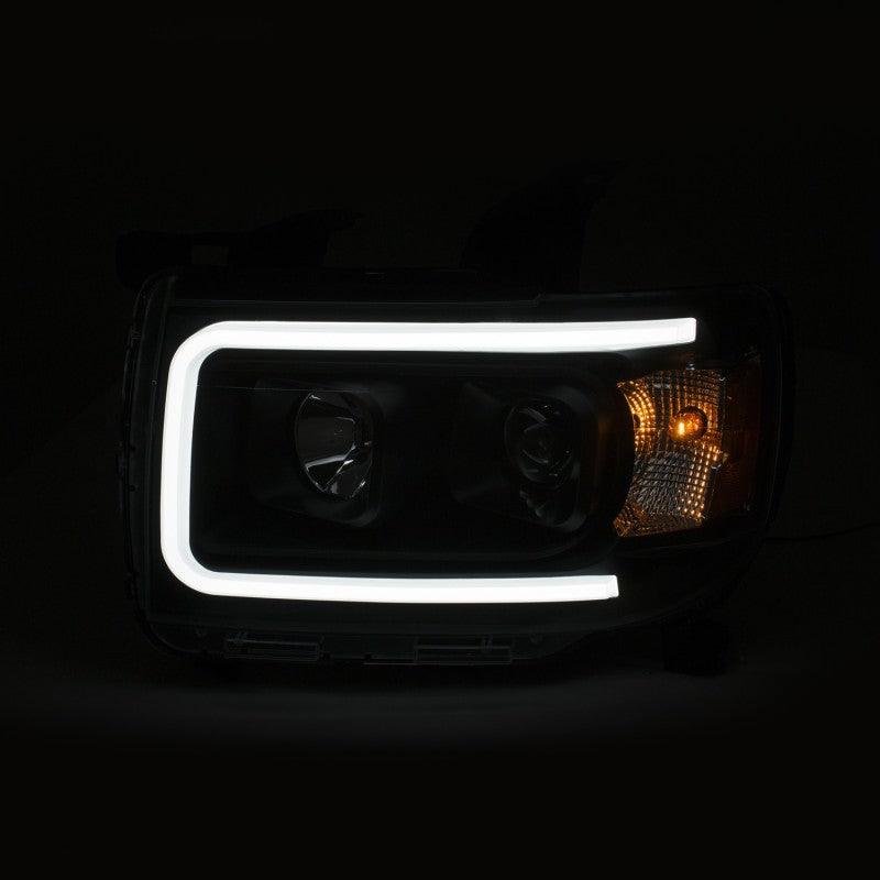 ANZO 2015+ GMC Canyon Projector Headlights with black housing and clear lens, showcasing a modern plank style design.