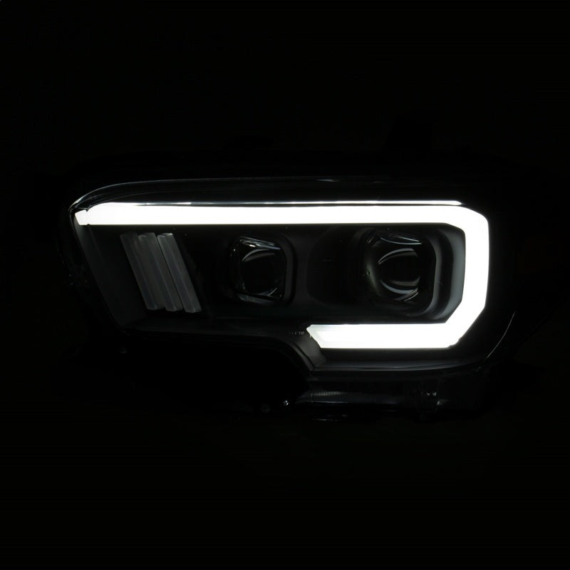 ANZO 2016-2017 Toyota Tacoma Projector Headlights with plank style switch, showcasing modern design and advanced lighting technology.