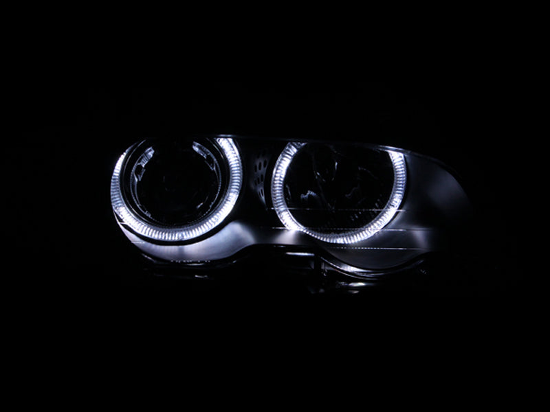 ANZO projector headlights with halo lights for 2000-2003 BMW 3 Series E46, featuring black housing and clear lens.