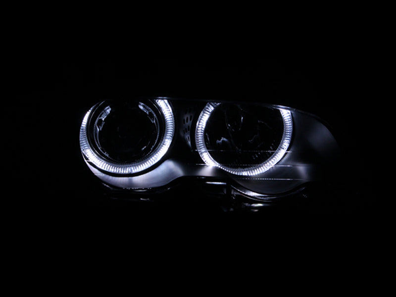ANZO projector headlights with halo lights for 2000-2003 BMW 3 Series E46, featuring black housing and clear lens.