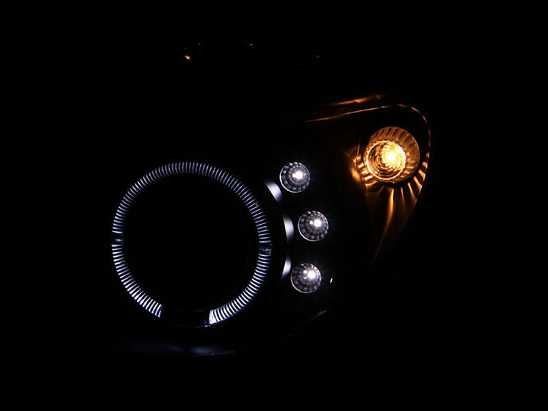 ANZO projector headlights with halo design for 2002-2003 Subaru Impreza, featuring black housing and clear lens.