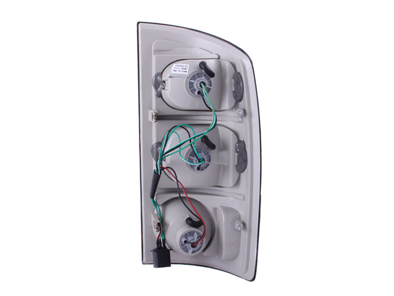 ANZO 2002-2005 Dodge Ram 1500 taillights with smoke lens, showcasing a sleek design and modern appearance.