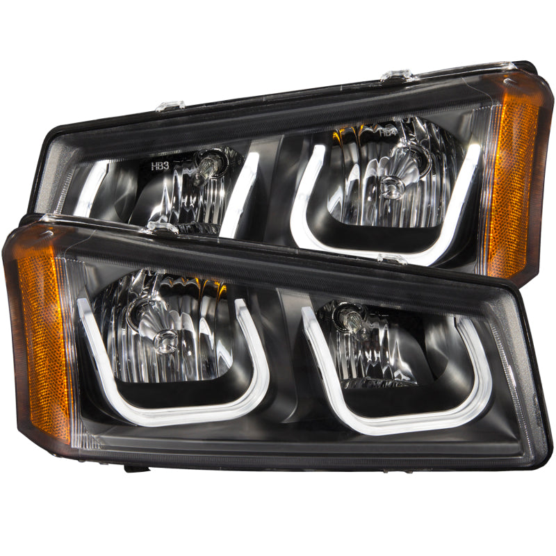 ANZO projector headlights for 2003-2006 Chevrolet Silverado 1500 with U-Bar design, featuring clear lens and black housing.
