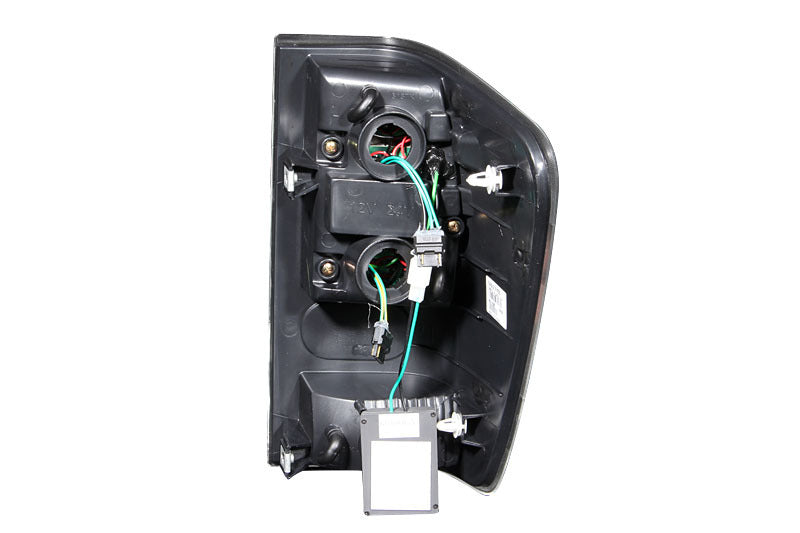 ANZO 2004-2015 Nissan Titan LED Taillights in black housing with clear lens, showcasing modern design and bright LED lights.