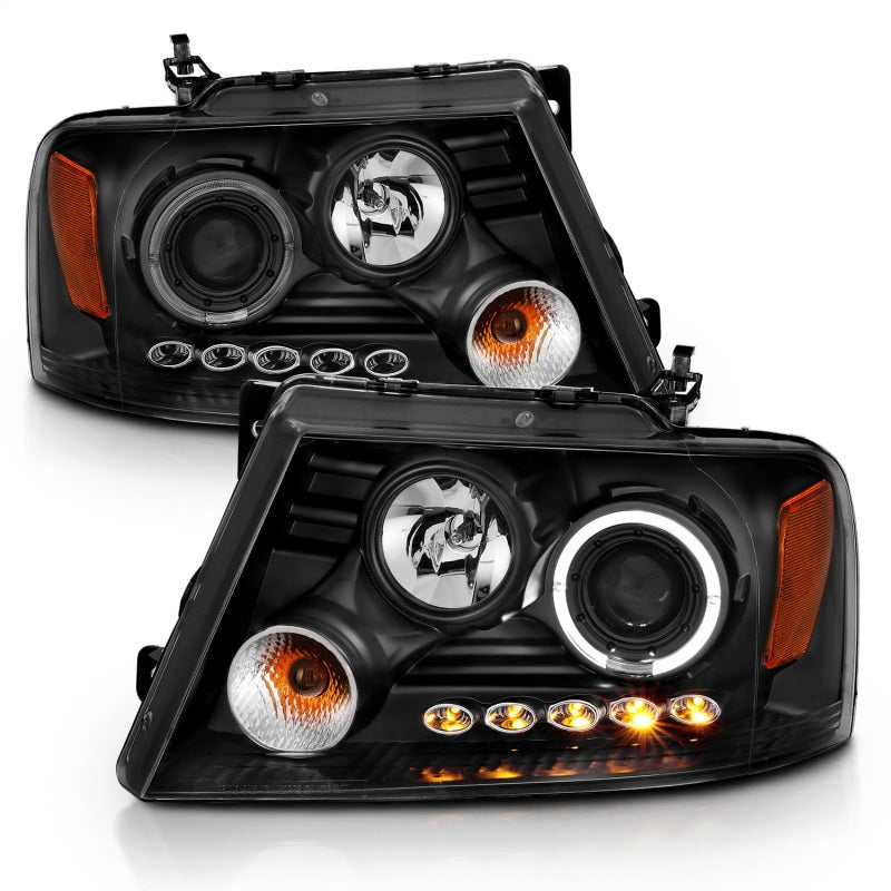ANZO 2004-2008 Ford F-150 projector headlights with halo and LED lights, featuring a sleek black housing and clear lens design.