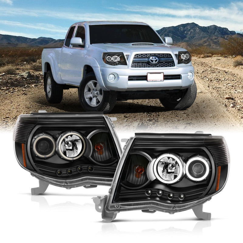 ANZO 2005-2011 Toyota Tacoma Projector Headlights with Halo in black housing, showcasing clear lens and stylish design.