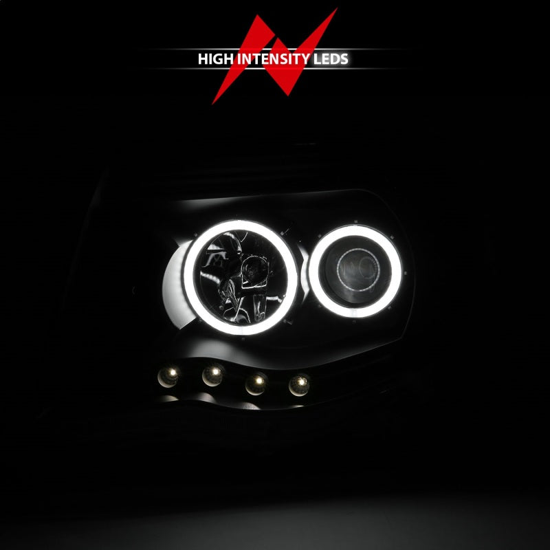 ANZO 2005-2011 Toyota Tacoma Projector Headlights with Halo in black housing, showcasing clear lens and stylish design.