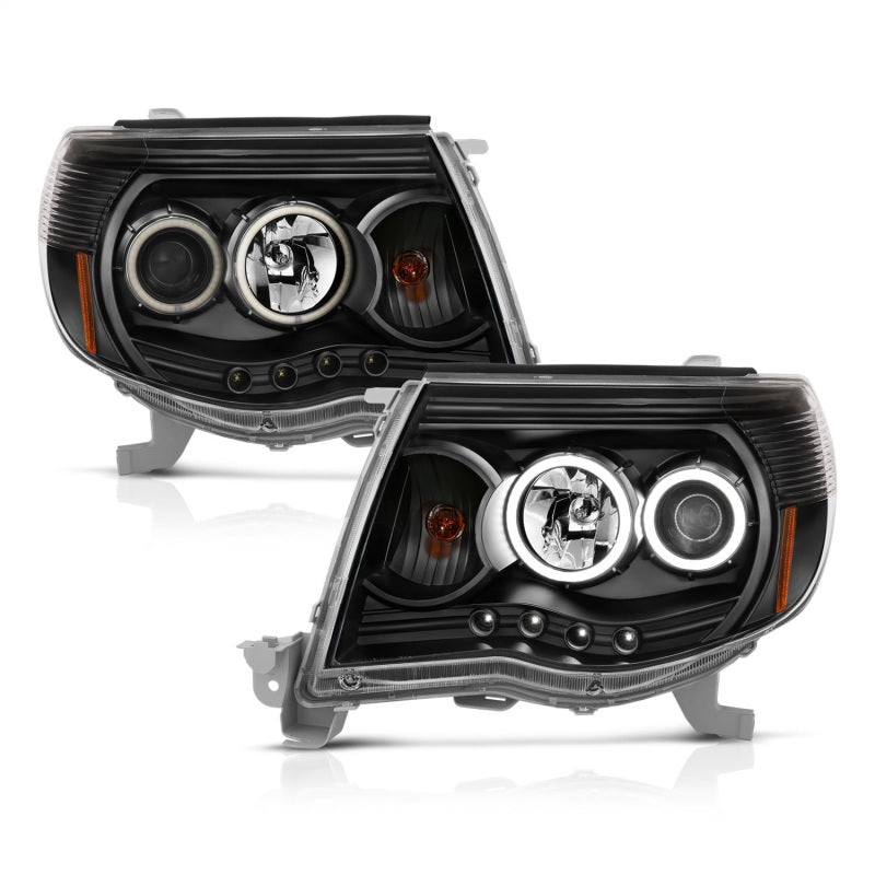 ANZO 2005-2011 Toyota Tacoma Projector Headlights with Halo in black housing, showcasing clear lens and stylish design.