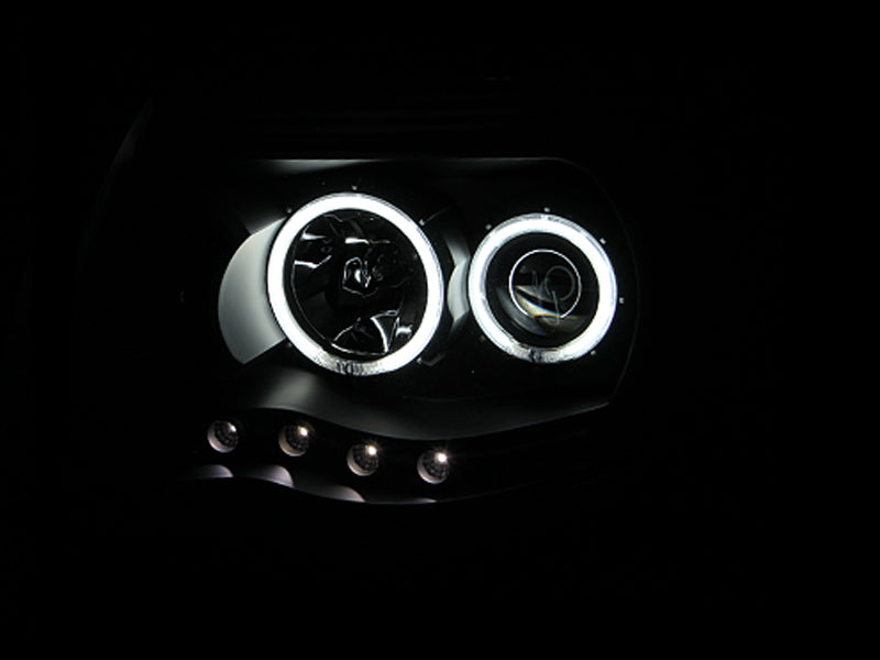 ANZO 2005-2011 Toyota Tacoma Projector Headlights with Halo in black housing, showcasing clear lens and stylish design.