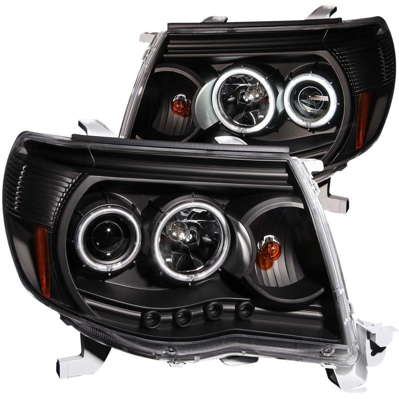 ANZO 2005-2011 Toyota Tacoma Projector Headlights with Halo in black housing, showcasing clear lens and stylish design.