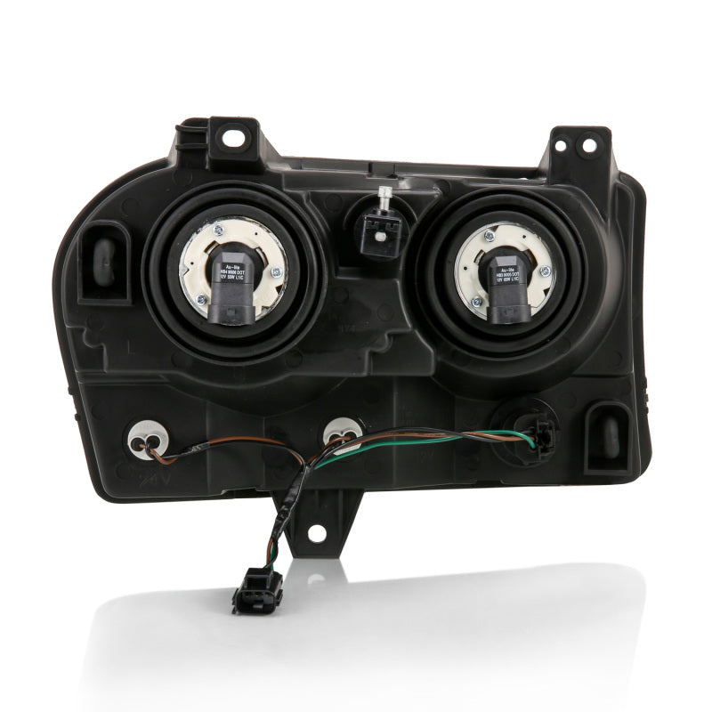 ANZO 2005-2010 Chrysler 300 Crystal Headlight Set with clear lens and black housing, showcasing modern automotive design.