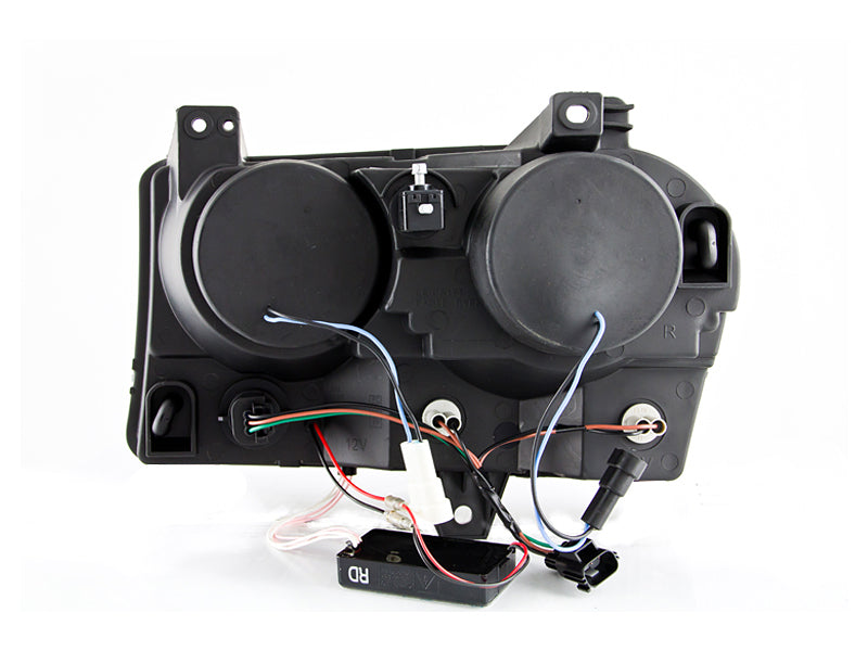 ANZO 2005-2010 Chrysler 300 projector headlights with halo black design, showcasing clear lens and black housing.