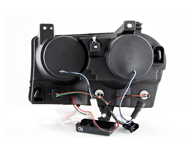 ANZO 2005-2010 Chrysler 300 projector headlights with halo black design, showcasing clear lens and black housing.