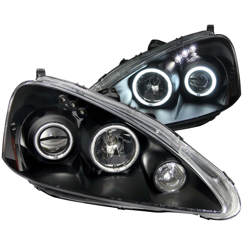 ANZO 2005-2006 Acura RSX projector headlights with halo lights and black housing, showcasing a modern design.