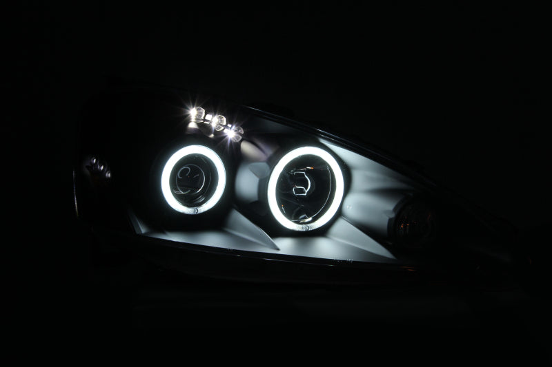 ANZO 2005-2006 Acura RSX projector headlights with halo lights and black housing, showcasing a modern design.