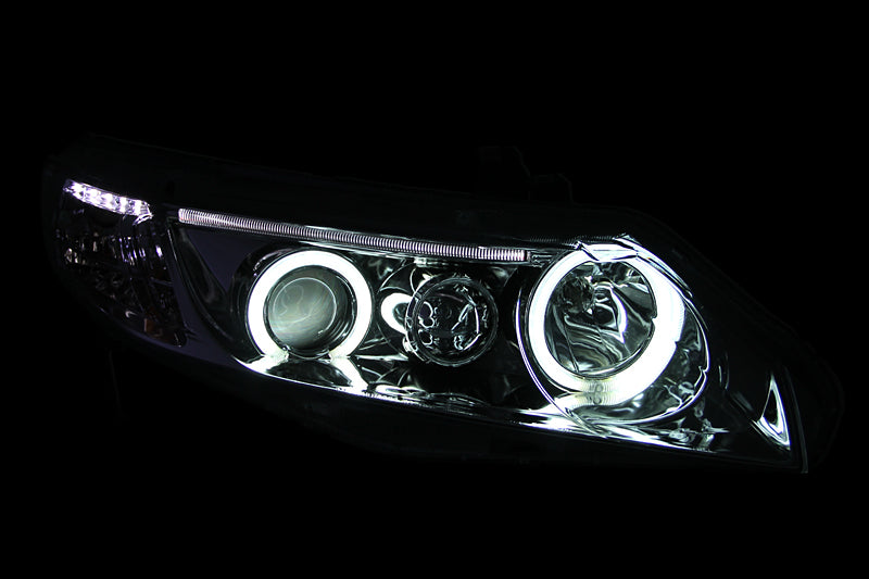 ANZO 2006-2011 Honda Civic Projector Headlights with Halo Chrome, showcasing clear lens and chrome housing design.