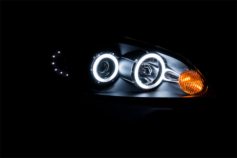 ANZO 2006-2007 Chevrolet Monte Carlo projector headlights with halo and black housing, showcasing clear lens design.