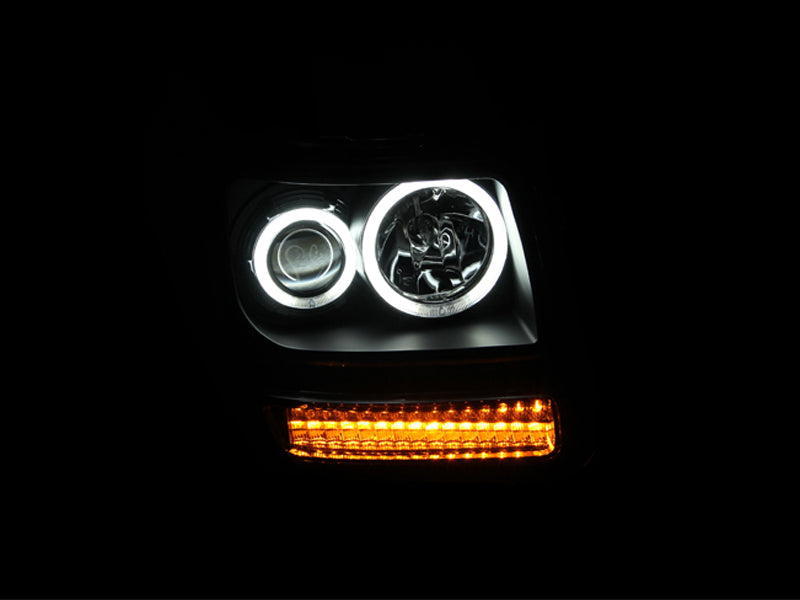 ANZO 2007-2012 Dodge Nitro Projector Headlights with Halo Black CCFL, showcasing sleek black housing and clear lens design.