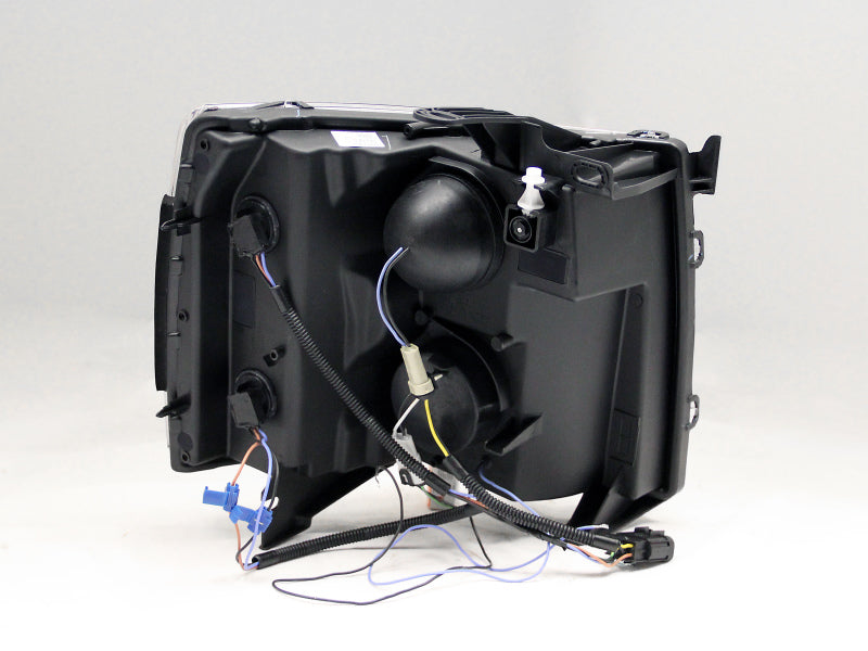 ANZO projector headlights for 2007-2013 Chevrolet Silverado 1500 with clear lens and chrome housing featuring a U-Bar design.