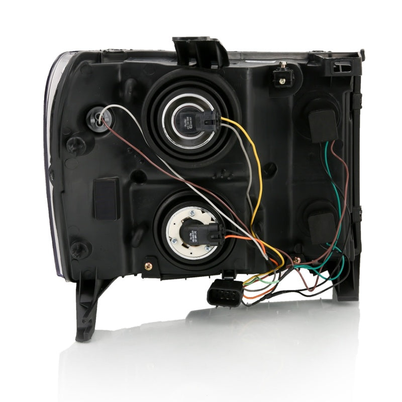 ANZO Crystal Headlight for GMC Sierra 1500, featuring a black amber design and crystal clear lens for enhanced visibility.