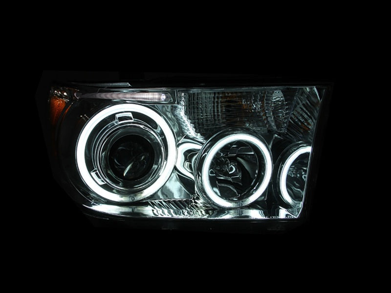 ANZO 2007-2013 Toyota Tundra Projector Headlights with Halo in black housing, showcasing clear lens and stylish design.