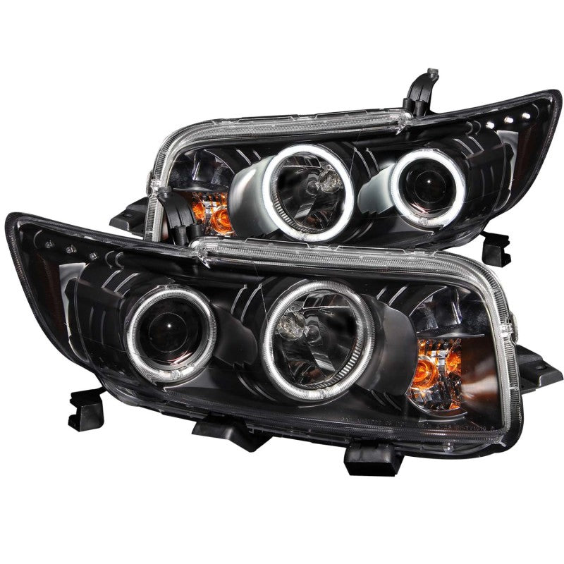 ANZO projector headlights with halo for 2008-2010 Scion xB, featuring black housing and clear lens.