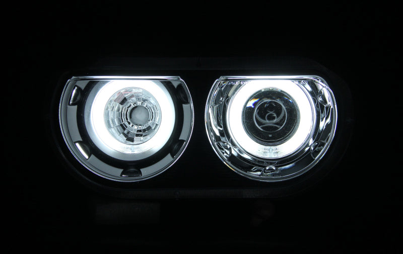 ANZO 2008-2014 Dodge Challenger projector headlights with halo black design, showcasing clear lens and sleek black housing.