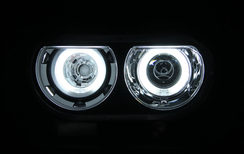 ANZO 2008-2014 Dodge Challenger projector headlights with halo black design, showcasing clear lens and sleek black housing.