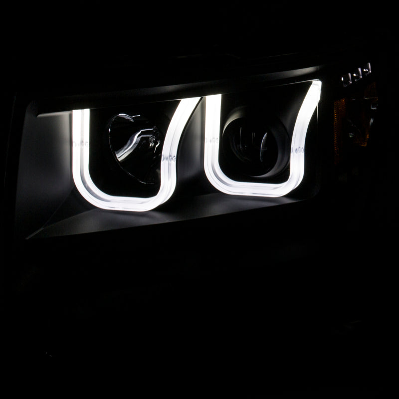 ANZO 2009-2014 Ford F-150 projector headlights with U-Bar design in black amber finish, showcasing modern styling and enhanced visibility.