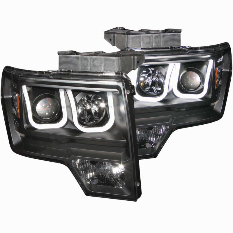 ANZO 2009-2014 Ford F-150 projector headlights with U-Bar in black housing, showcasing clear lens and modern design.