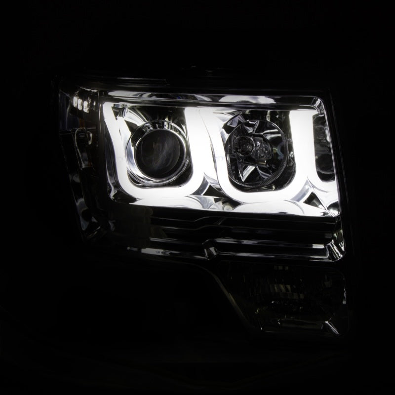 ANZO 2009-2014 Ford F-150 projector headlights with U-Bar chrome housing, showcasing clear lens and modern design.