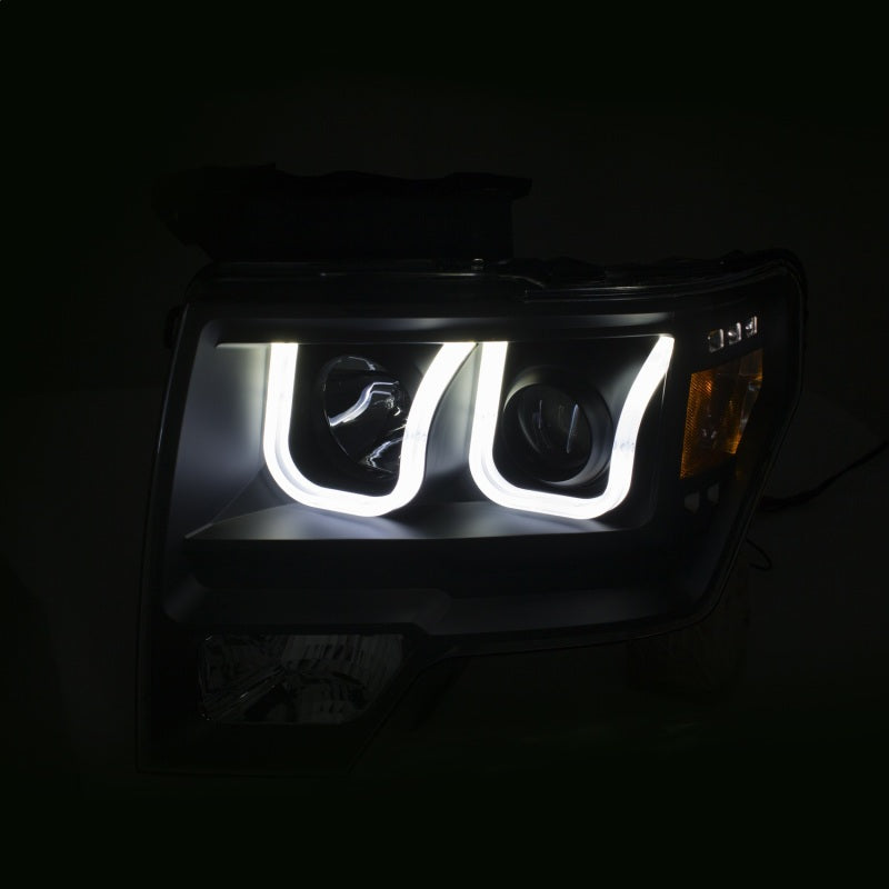 ANZO projector headlights for 2009-2014 Ford F-150 with U-Bar switchback design, showcasing modern styling and enhanced visibility.