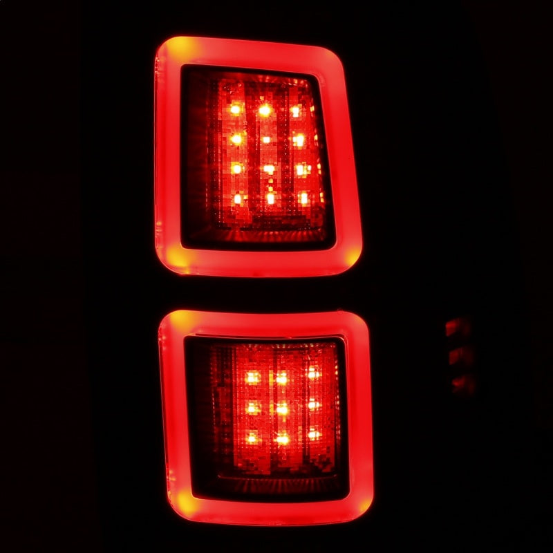 ANZO LED Black Taillights for 2013-2017 Dodge Ram 1500/2500/3500, featuring a sleek red/smoke lens design.