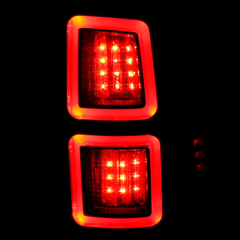 ANZO LED Black Taillights for 2013-2017 Dodge Ram 1500/2500/3500, featuring a sleek red/smoke lens design.
