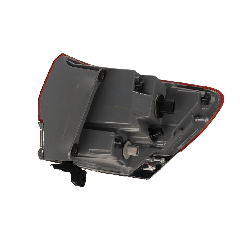 Omix Left Tail Light Assembly for 2014-2018 Jeep Grand Cherokee, featuring housing, lens, and bulbs.