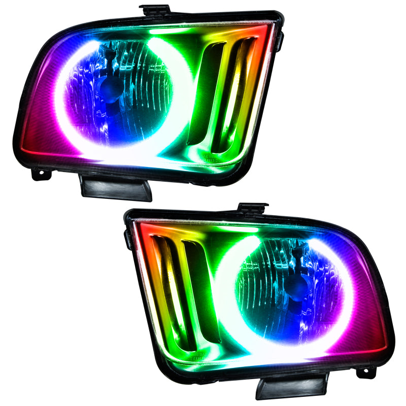 Oracle 05-09 Ford Mustang SMD headlights with ColorSHIFT halo rings in Chrome housing, showcasing modern automotive lighting design.