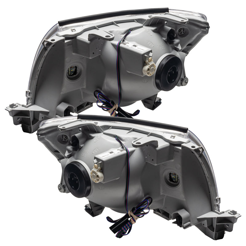 Oracle 05-11 Toyota Tacoma SMD headlights in black housing with white halo rings, showcasing a modern design.