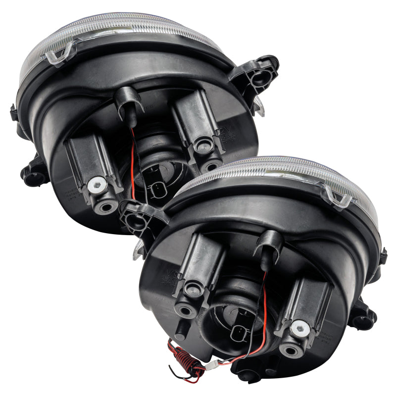 Oracle 07-16 Jeep Patriot/Compass headlights with ColorSHIFT halos, showcasing sleek design and professional installation.