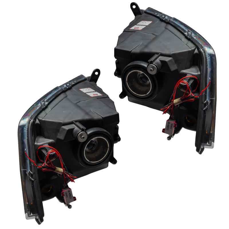 Oracle 09-12 Dodge Ram Non-Sport SMD Headlights in black housing with white halo rings, showcasing a modern design.