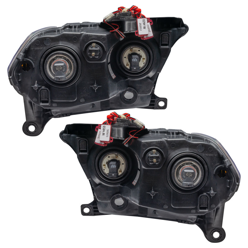 Oracle 11-13 Dodge Durango SMD HL Halogen headlights with black housing and blue halo rings, showcasing a modern design.