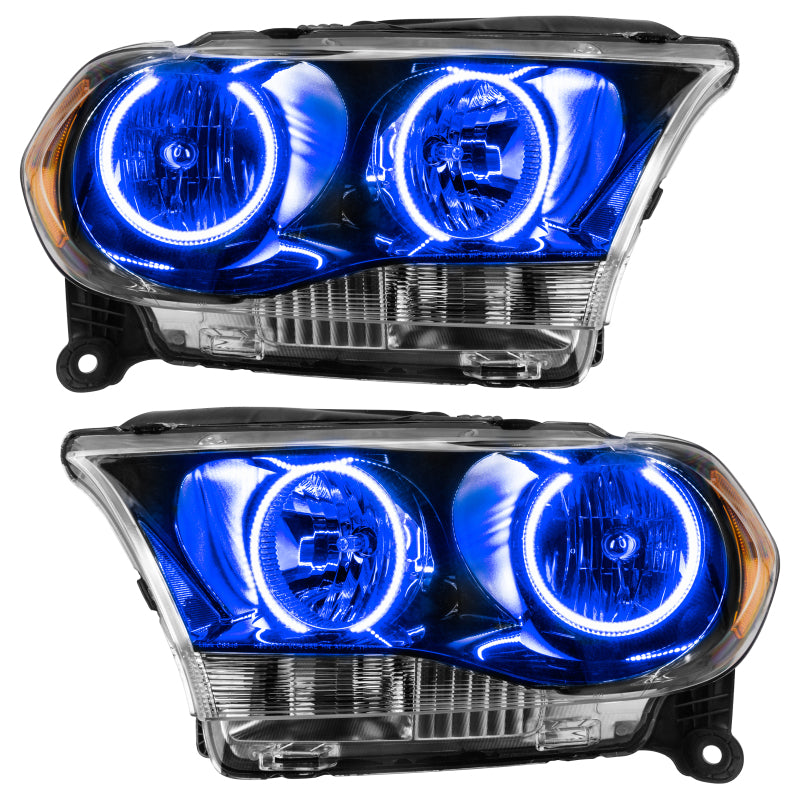 Oracle 11-13 Dodge Durango SMD HL Halogen headlights with black housing and blue halo rings, showcasing a modern design.