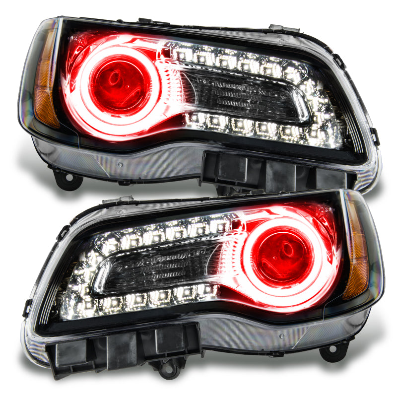 Oracle 11-14 Chrysler 300C SMD headlights in black with red halo rings, showcasing a sleek design and vibrant lighting.