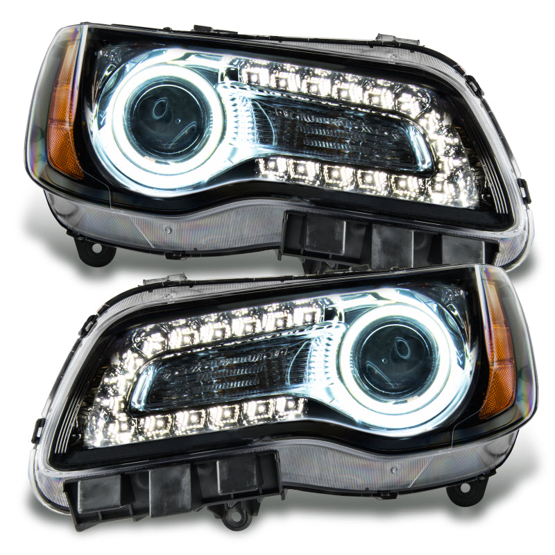 Oracle 11-14 Chrysler 300C SMD headlights in black housing with white halo rings, showcasing a modern and stylish design.