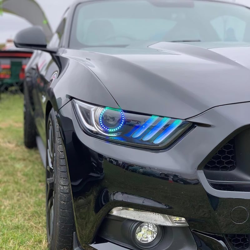 Oracle Dynamic RGB+A headlights for 2015-2017 Ford Mustang with blacked-out housing and colorful LED features.
