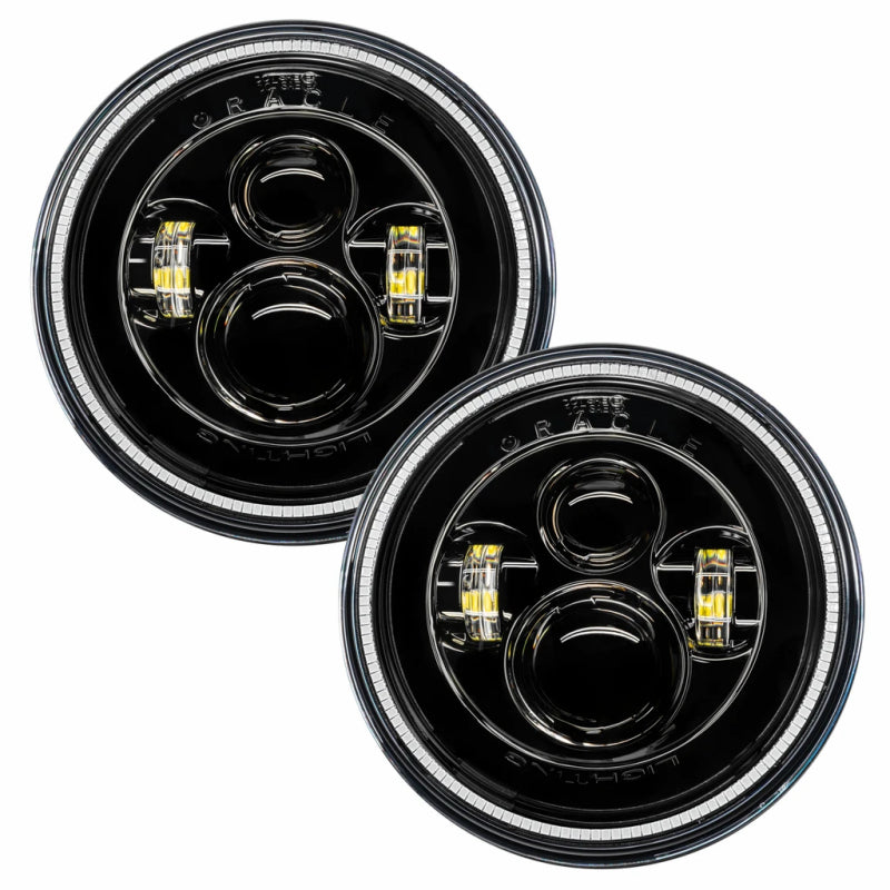 Oracle 7in High Powered LED Headlights with Black Bezel and Amber accents, showcasing rugged design and advanced lighting technology.