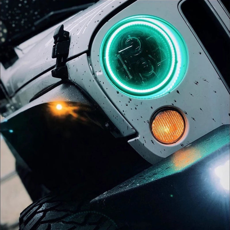 Oracle 7in High Powered LED Headlights with black bezel and customizable color halos, designed for Jeep Wranglers and off-road vehicles.