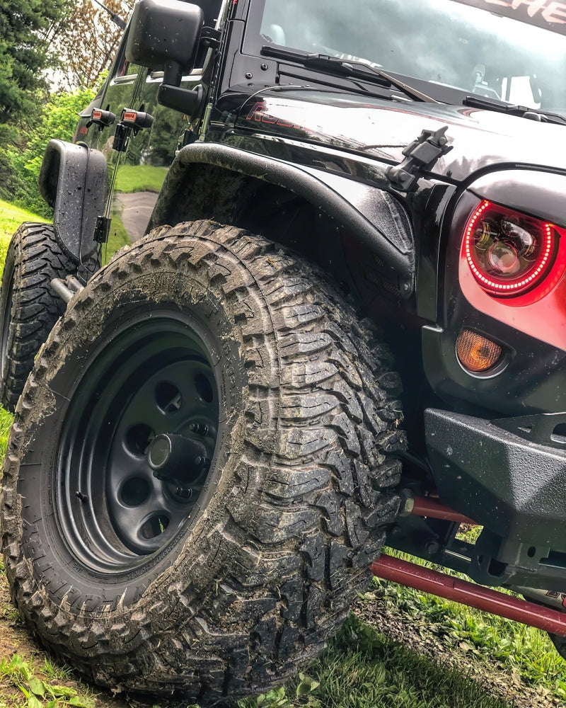 Oracle 7in High Powered LED Headlights with black bezel, showcasing dynamic color features and rugged design for Jeep Wrangler and off-road vehicles.