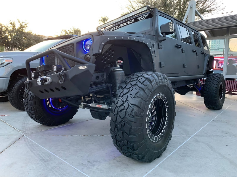 Oracle 7in High Powered LED Headlights with black bezel, showcasing dynamic color features and rugged design for Jeep Wrangler and off-road vehicles.