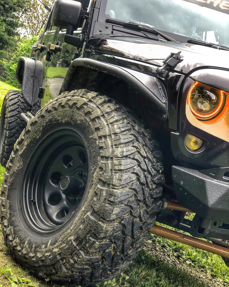 Oracle 7in High Powered LED Headlights with black bezel, showcasing dynamic color features and rugged design for Jeep Wrangler and off-road vehicles.