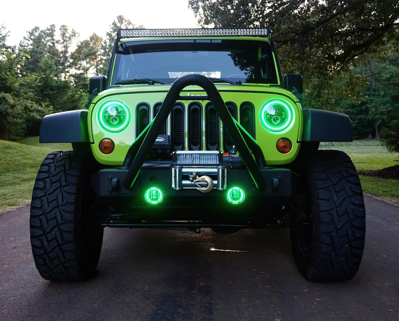 Oracle 7in High Powered LED Headlights with black bezel, showcasing dynamic color features and rugged design for Jeep Wrangler and off-road vehicles.